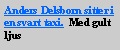 Text Box: Anders Delsborn sitter i en svart taxi. Med gult ljus